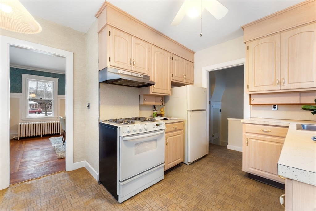 10 Hinckley Road Newton, MA 02468 - Photo 16 of 41 a kitchen with stainless steel appliances granite countertop a refrigerator a stove and a sink with dishwasher