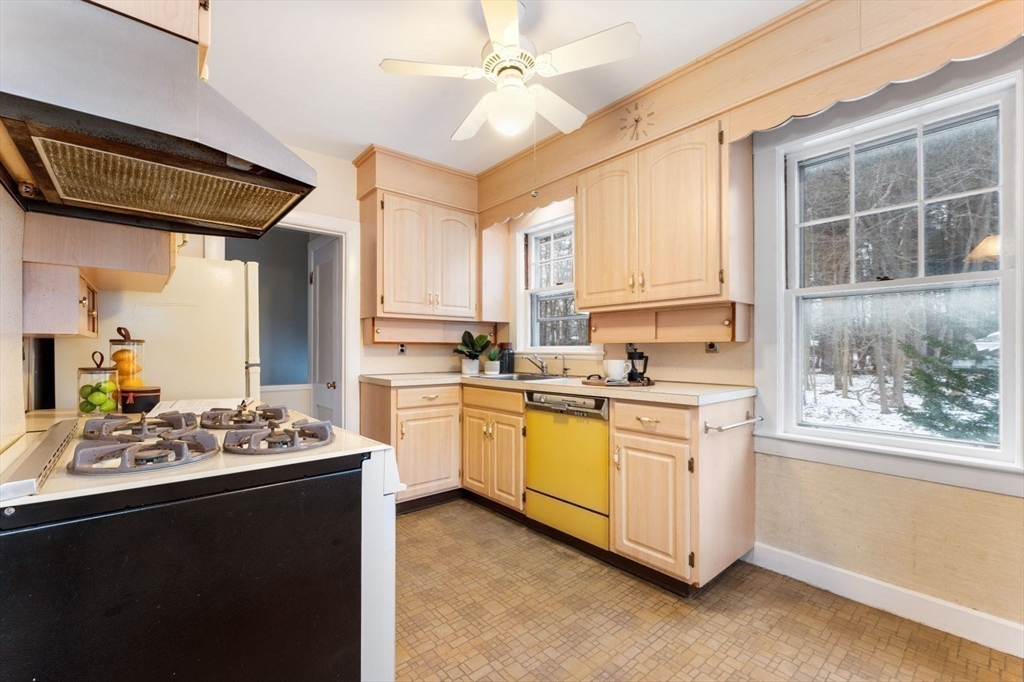 10 Hinckley Road Newton, MA 02468 - Photo 17 of 41 a kitchen with stainless steel appliances kitchen island granite countertop a sink stove and cabinets