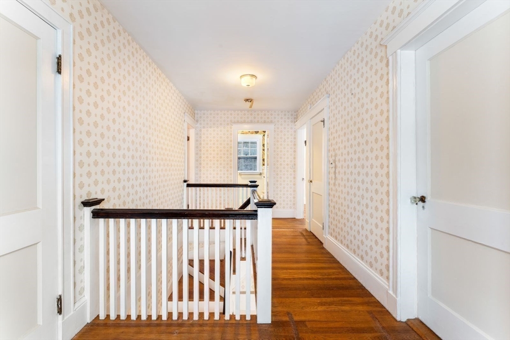 10 Hinckley Road Newton, MA 02468 - Photo 20 of 41 a view of a hallway with wooden floor and a window
