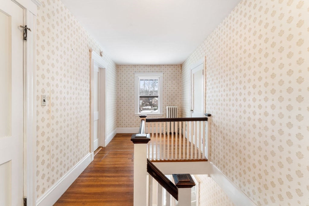 10 Hinckley Road Newton, MA 02468 - Photo 21 of 41 a view of a bedroom with wooden floor
