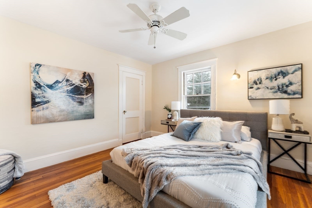 10 Hinckley Road Newton, MA 02468 - Photo 22 of 41 a bedroom with a bed and a painting on the wall