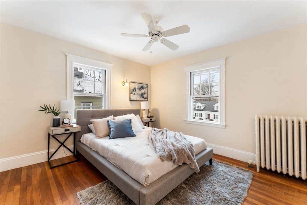 10 Hinckley Road Newton, MA 02468 - Photo 24 of 41 a bedroom with a bed and wooden floor