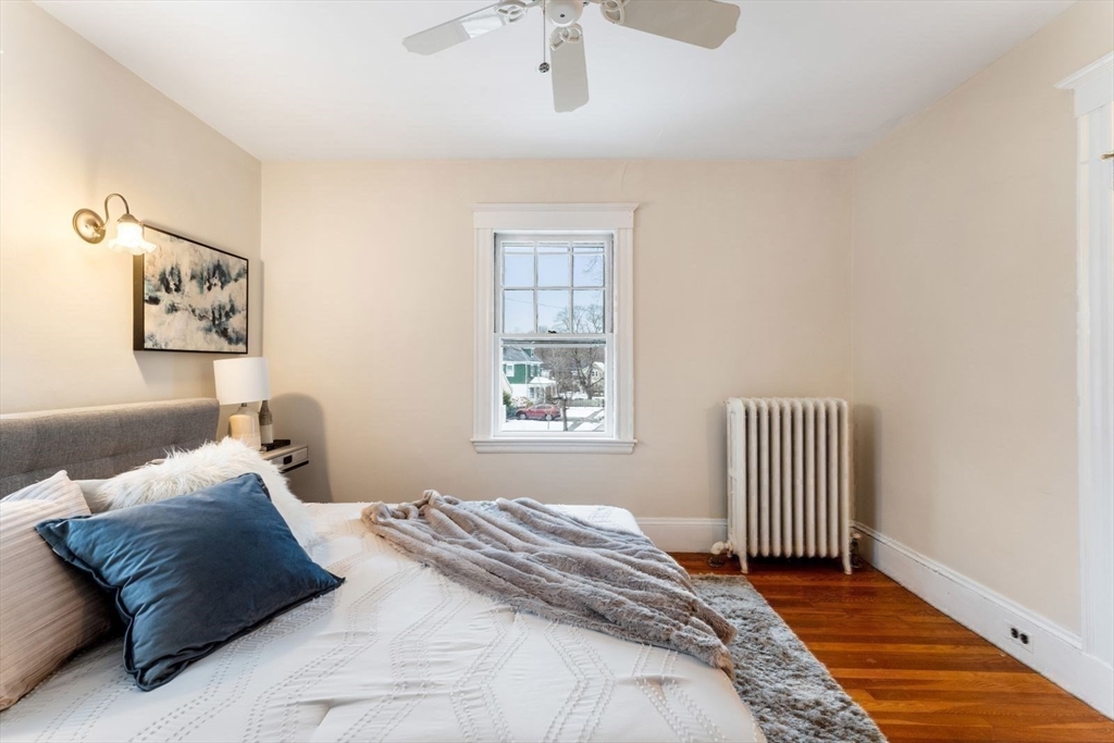 10 Hinckley Road Newton, MA 02468 - Photo 25 of 41 a bedroom with a bed and a window