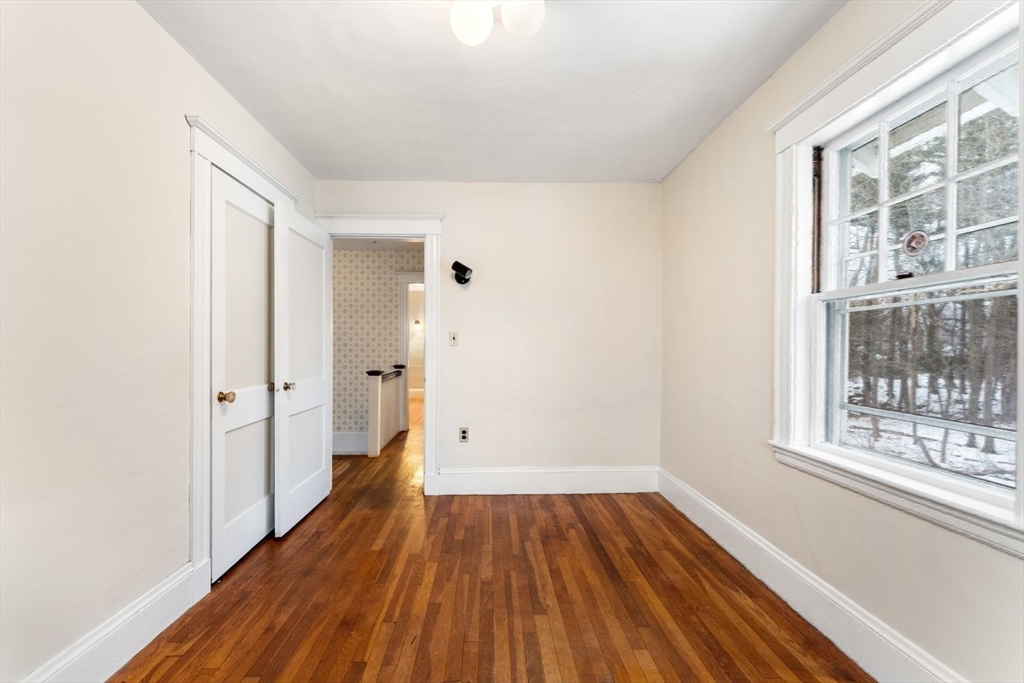 10 Hinckley Road Newton, MA 02468 - Photo 26 of 41 a view of a room with wooden floor and windows