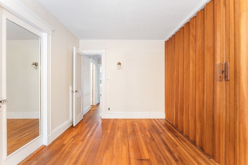10 Hinckley Road Newton, MA 02468 - Photo 28 of 41 a view of a hallway with wooden floor