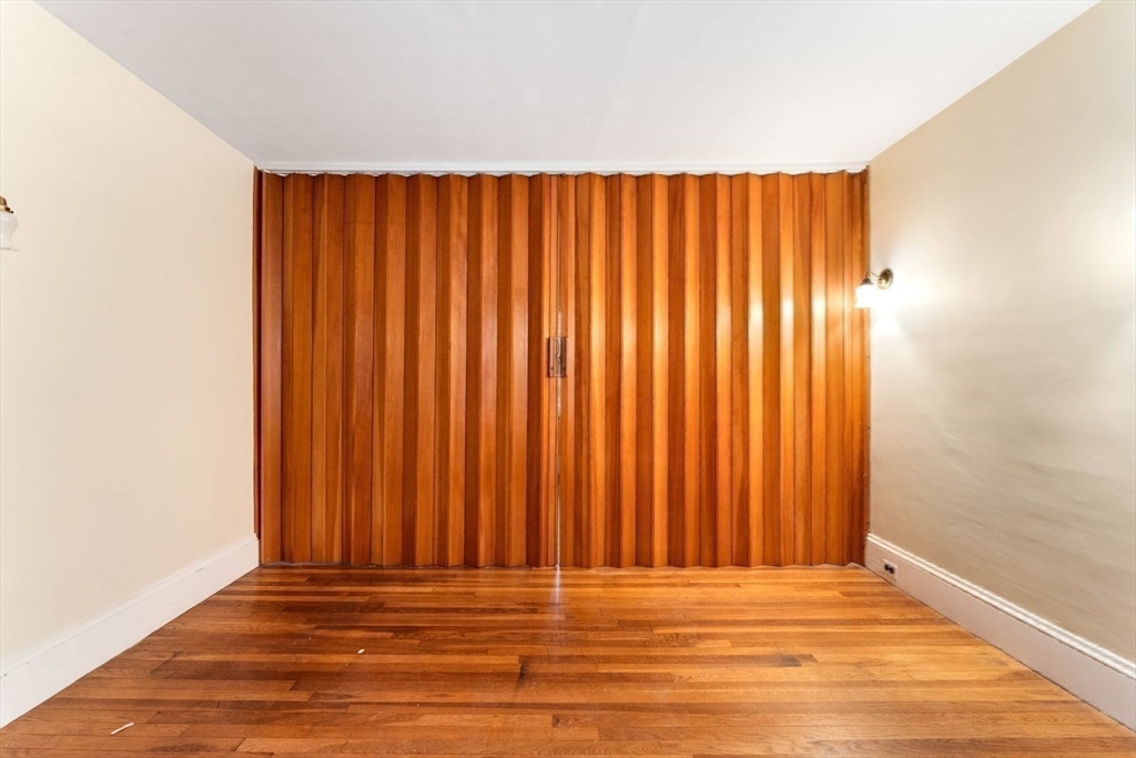 10 Hinckley Road Newton, MA 02468 - Photo 30 of 41 a view of wooden floor and curtain