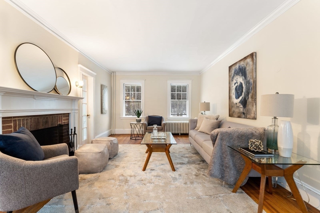10 Hinckley Road Newton, MA 02468 - Photo 6 of 41 a living room with furniture and a fireplace