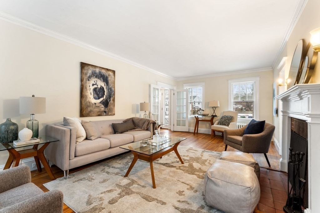10 Hinckley Road Newton, MA 02468 - Photo 8 of 41 a living room with furniture and a fireplace