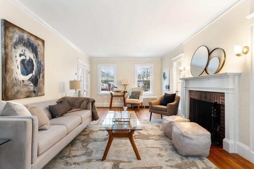 10 Hinckley Road Newton, MA 02468 - Photo 9 of 41 a living room with furniture and a fireplace