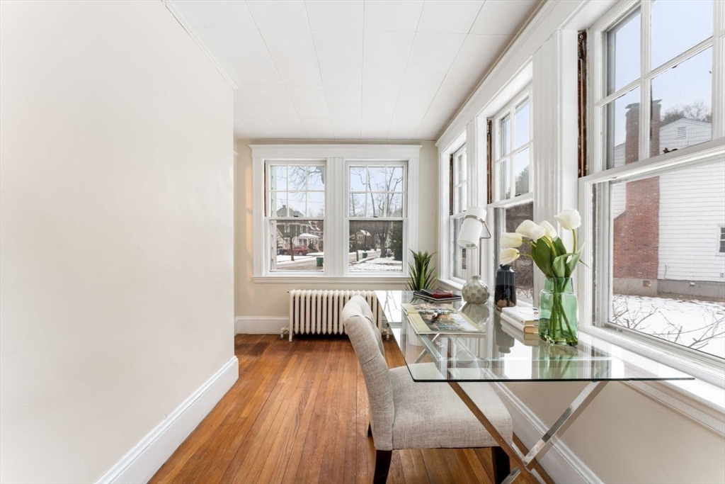 10 Hinckley Road Newton, MA 02468 - Photo 10 of 41 a living room with furniture and a large window