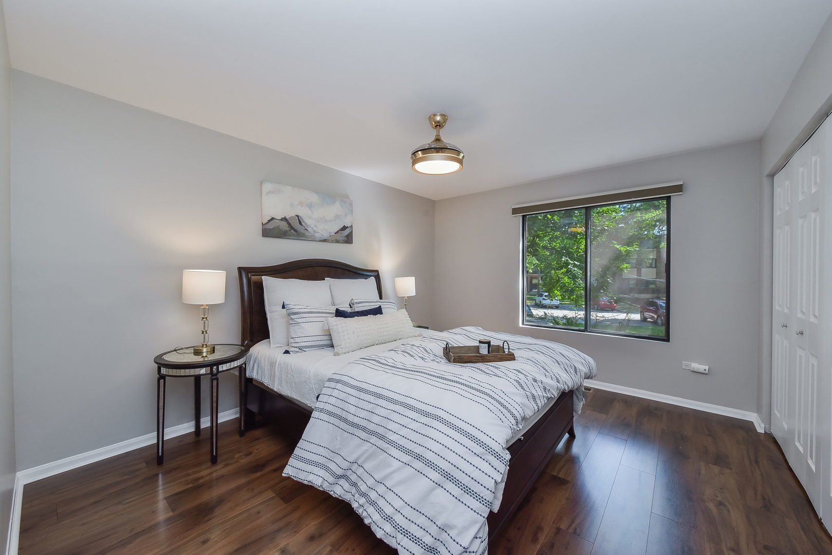 367 Sandhurst Circle, Unit 5 Glen Ellyn, IL 60137 - Photo 7 of 10 a bedroom with a bed and a window