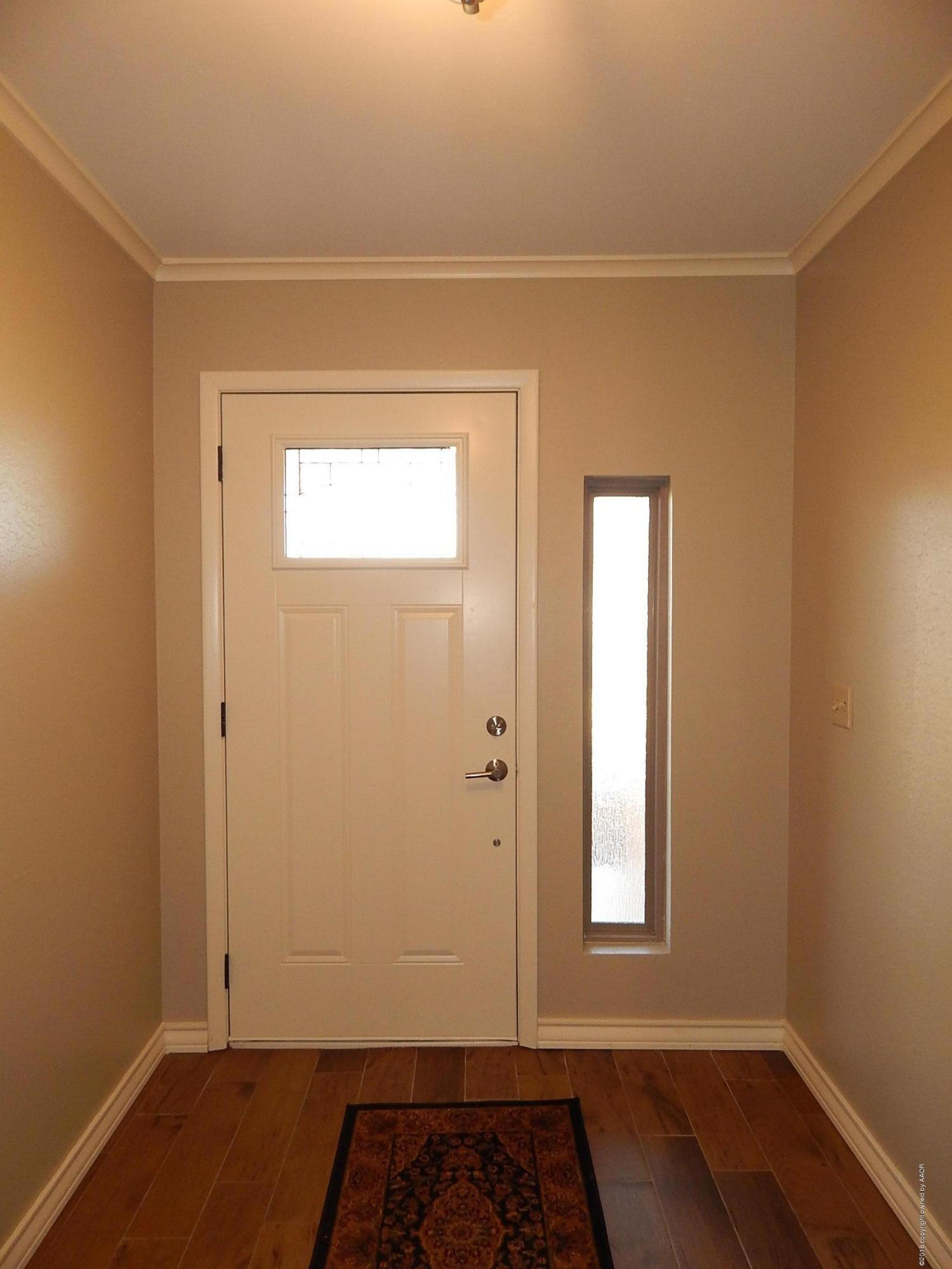 6703 Elmhurst Road Amarillo, TX 79106 - Photo 3 of 36 a view of an empty room and window
