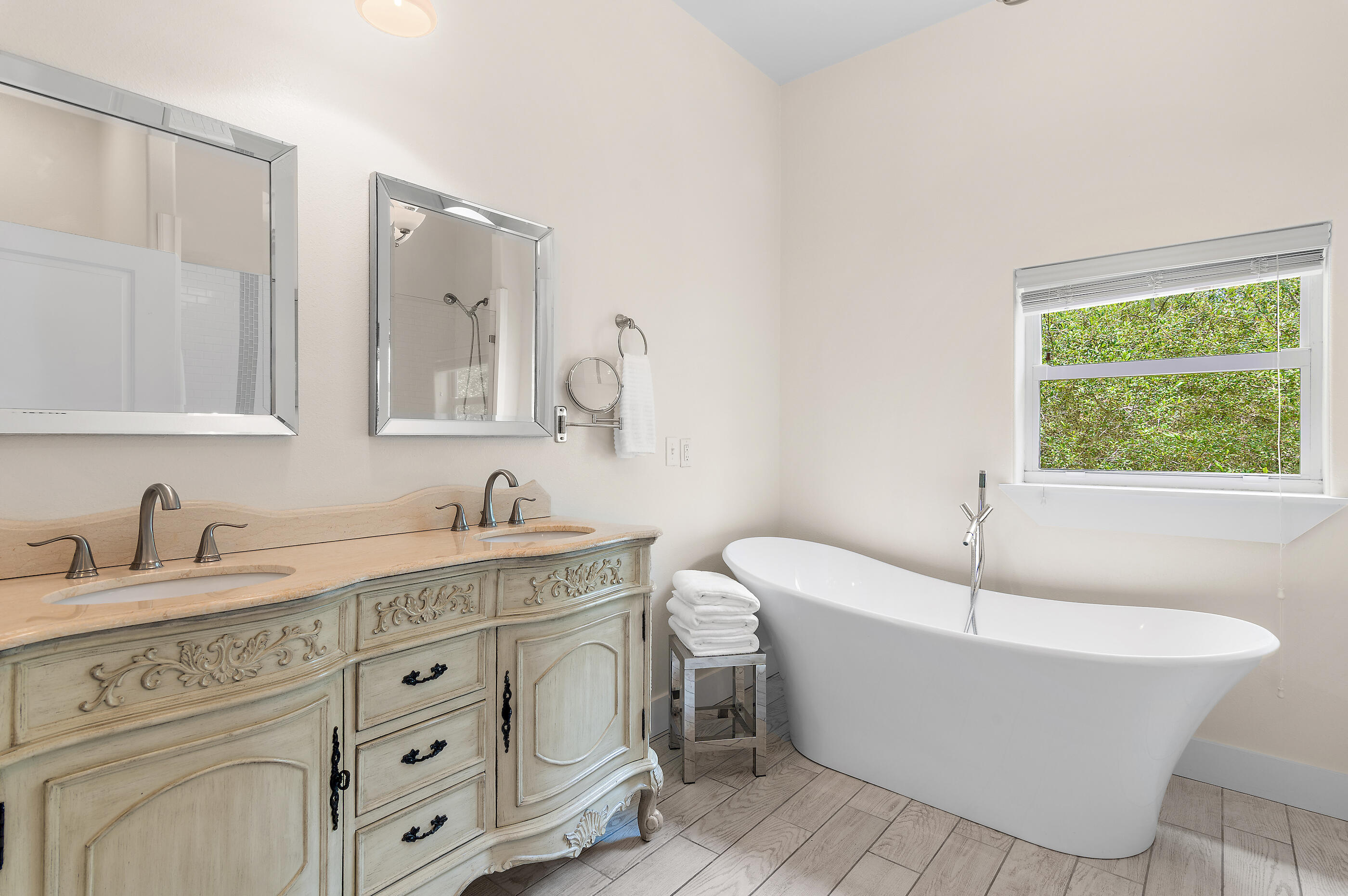 96 Hilltop Drive Santa Rosa Beach, FL 32459 - Photo 24 of 50 a bathroom with a bathtub sink and mirror