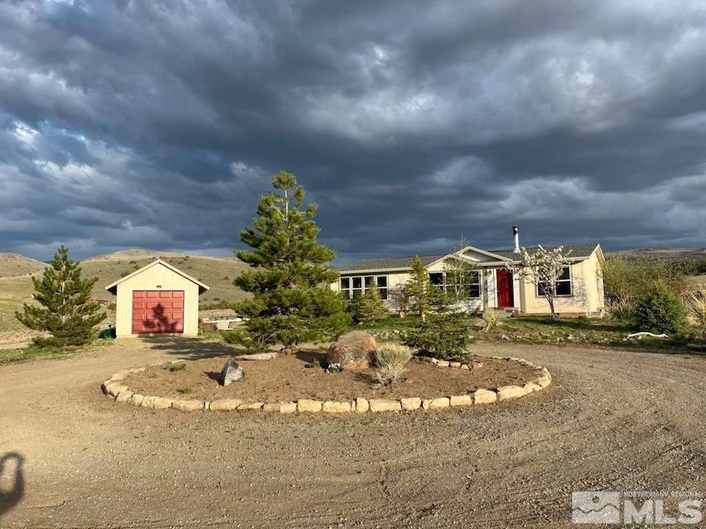 3395 Basque Oven Road Reno, NV 89510 - Photo 1 of 40 a view of a house with a yard and garage