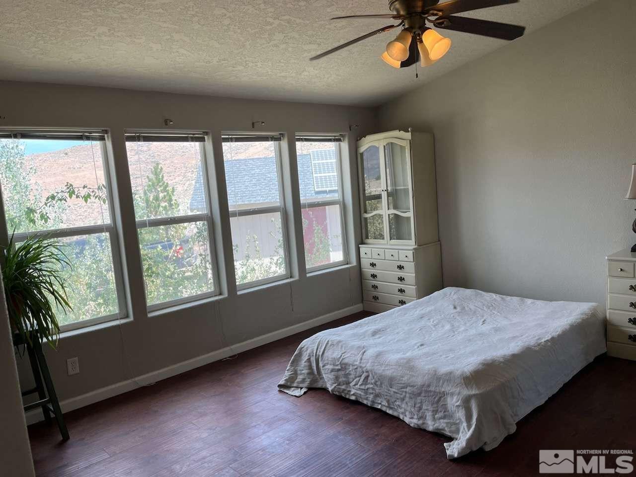 3395 Basque Oven Road Reno, NV 89510 - Photo 36 of 40 a bedroom with a large bed and a window