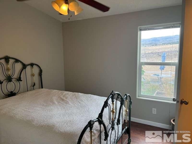 3395 Basque Oven Road Reno, NV 89510 - Photo 38 of 40 a bedroom with a bed and a window