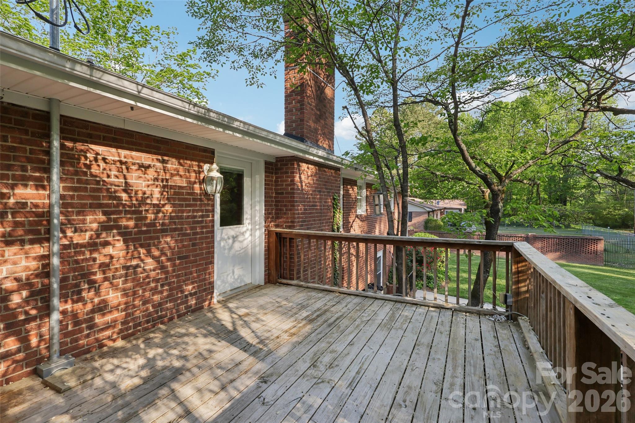 1002 Ridge Street Albemarle, NC 28001 - Photo 39 of 45 a view of balcony with wooden floor and fence