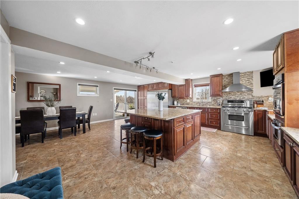 3032 Investors Road Washington, PA 15301 - Photo 13 of 50 Open eat-in kitchen with a large island connecting to the dining area, creating a seamless space for hosting 20+ guests.