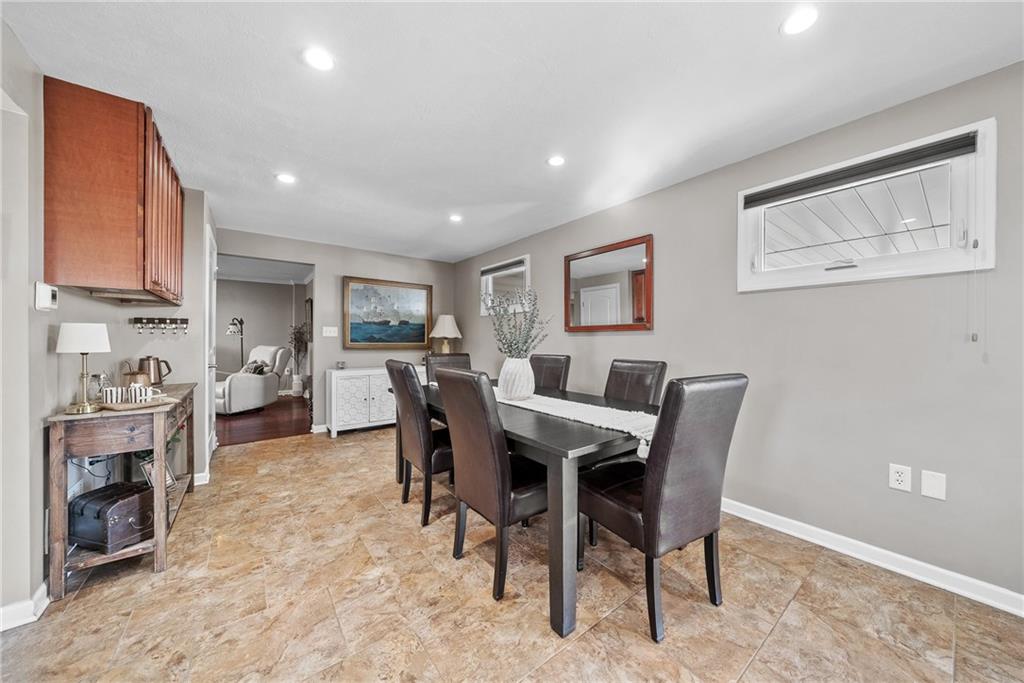 3032 Investors Road Washington, PA 15301 - Photo 14 of 50 Open eat-in kitchen with a large island connecting to the dining area, creating a seamless space for hosting 20+ guests.