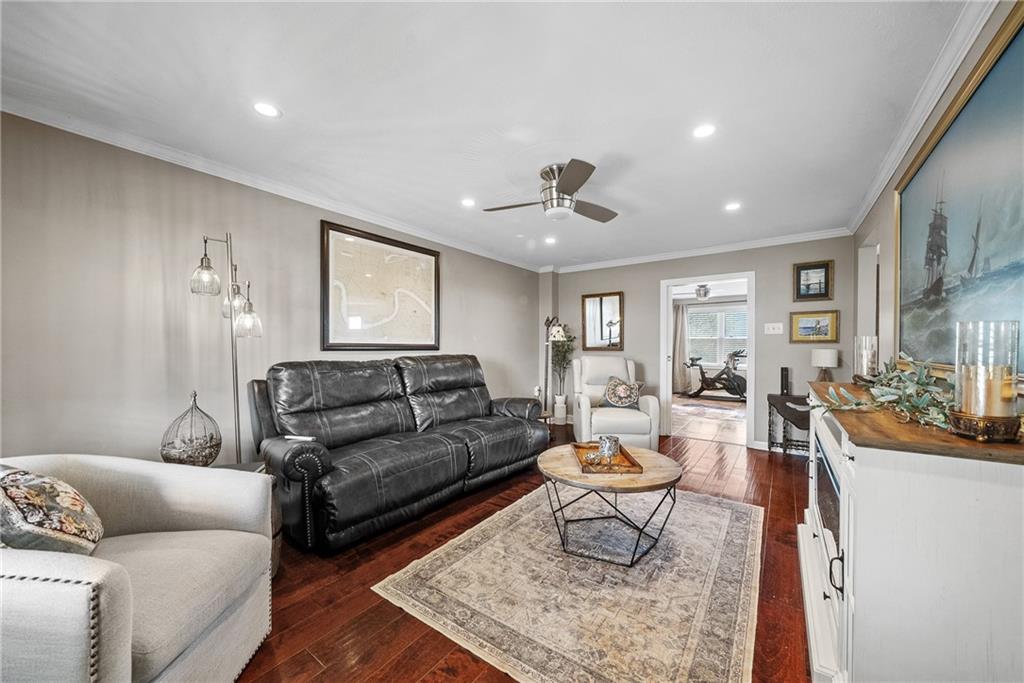 3032 Investors Road Washington, PA 15301 - Photo 16 of 50 Spacious living room just off the kitchen and dining area, a perfect spot for movie nights or entertaining while staying connected to guests.
