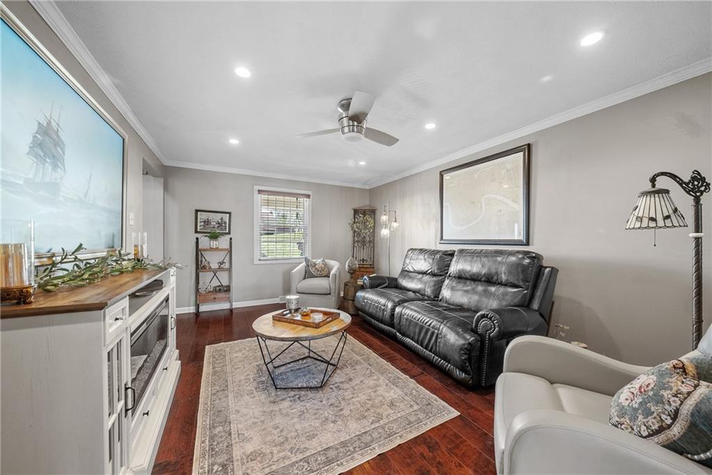 3032 Investors Road Washington, PA 15301 - Photo 18 of 50 Spacious living room just off the kitchen and dining area, a perfect spot for movie nights or entertaining while staying connected to guests.