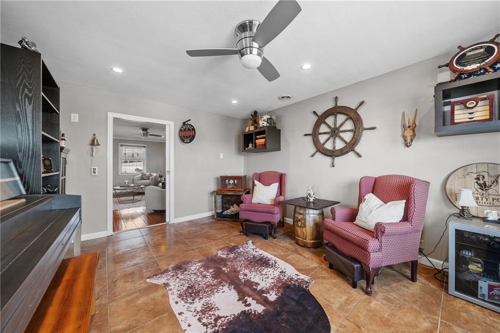 3032 Investors Road Washington, PA 15301 - Photo 20 of 50 Private den off the living room with pocket doors, perfect for a playroom, office, or quiet retreat, with convenient access to the outdoor deck.