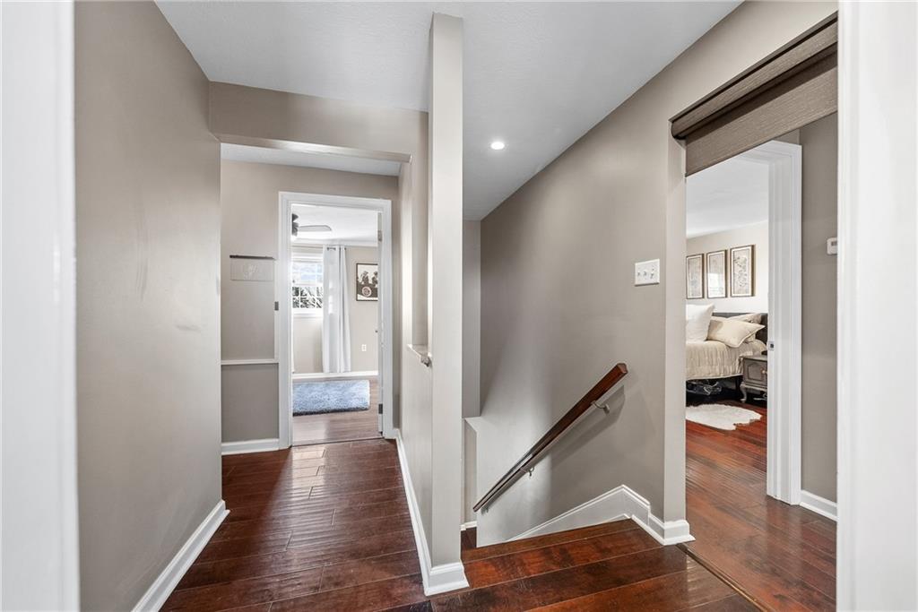 3032 Investors Road Washington, PA 15301 - Photo 21 of 50 Spacious staircase opens to the second floor hallway, showcasing the well-designed layout and the private separation of the owner’s suite.