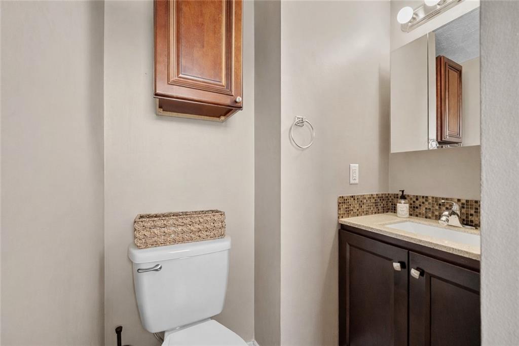 3032 Investors Road Washington, PA 15301 - Photo 34 of 50 Spacious secondary bedroom, formerly the owner’s bedroom, featuring an ensuite bathroom with stand-up shower and single vanity, along with a walk-in closet.