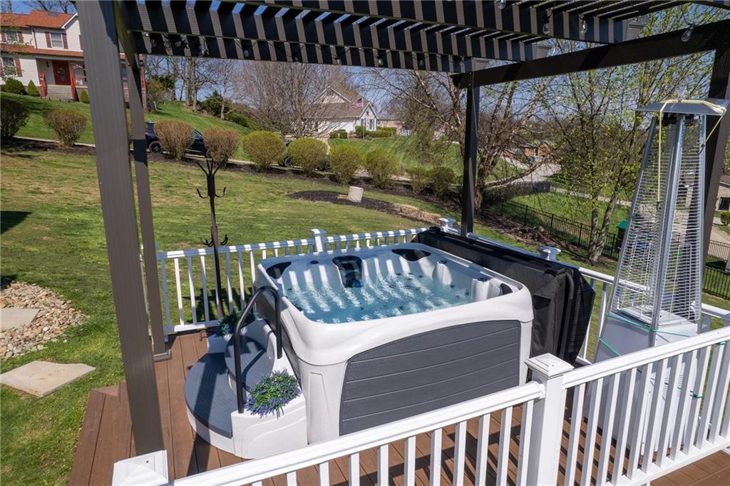 3032 Investors Road Washington, PA 15301 - Photo 45 of 50 New composite lower deck built in 2023 with a hot tub and pergola, creating a private outdoor retreat, all included with the property.