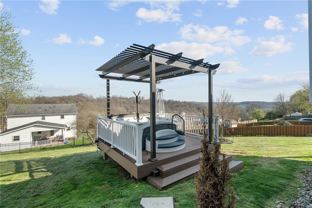 3032 Investors Road Washington, PA 15301 - Photo 46 of 50 New composite lower deck built in 2023 with a hot tub and pergola, creating a private outdoor retreat, all included with the property.