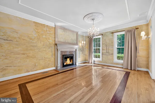 a view of an room with wooden floor and windows