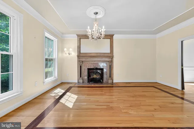 a view of room with window and hardwood floor