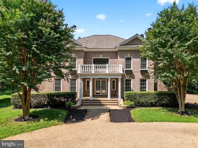 a view of a lush green hillside and a houses