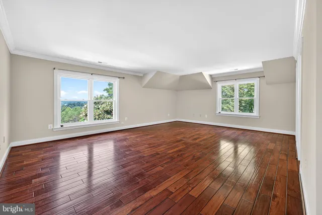 a view of room with window and ceiling fan