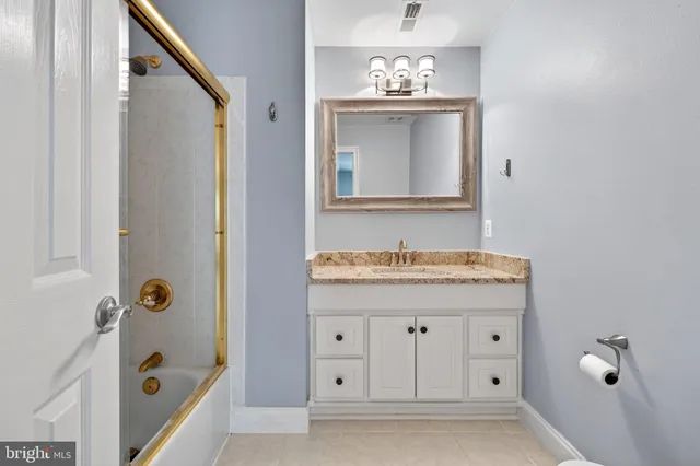 a room with a dresser and a mirror