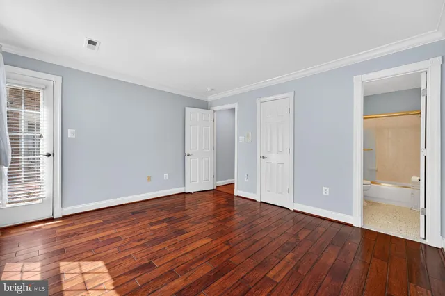 a view of balcony with wooden fence