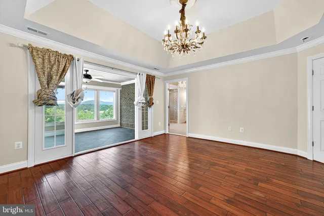 a view of house with backyard and sitting area