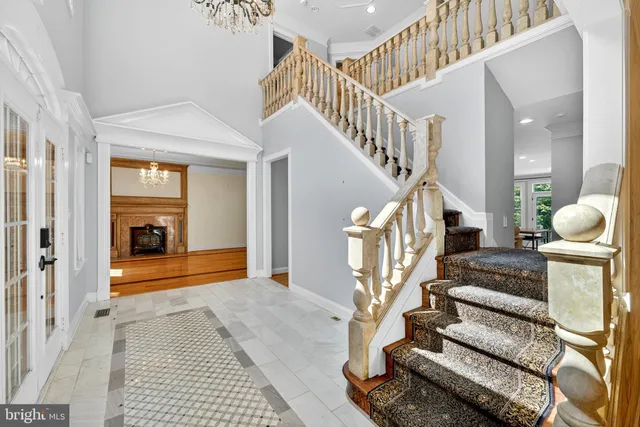 a view of a room with wooden floor and staircase
