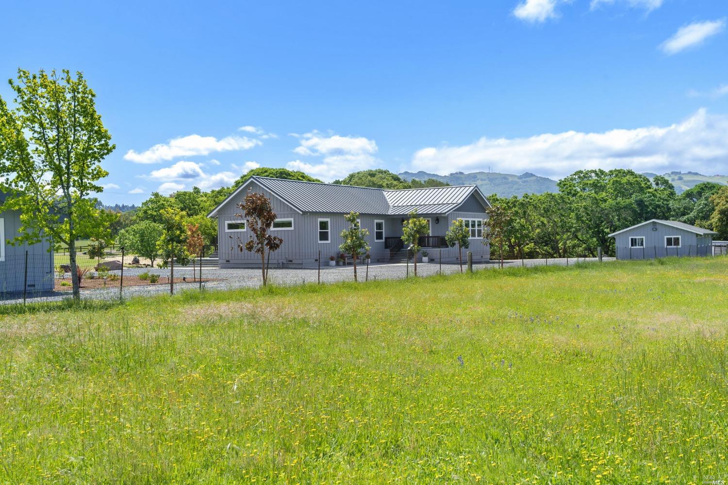a view of a house with a big yard