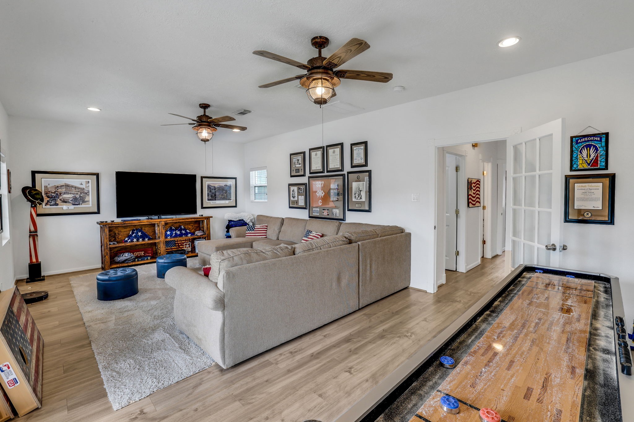 331 Holiday Lane Coldspring, TX 77331 - Photo 11 of 36 There is extra space in the first story living area for a game table or a shuffleboard table as shown here.