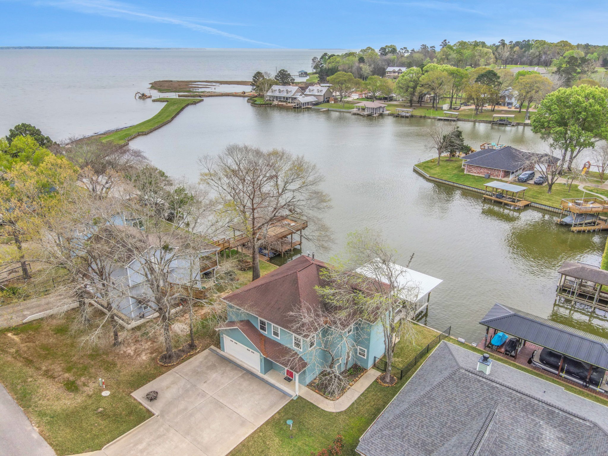331 Holiday Lane Coldspring, TX 77331 - Photo 4 of 36 Sit and relax on the back balcony of the home and enjoy an expansive view of the lake