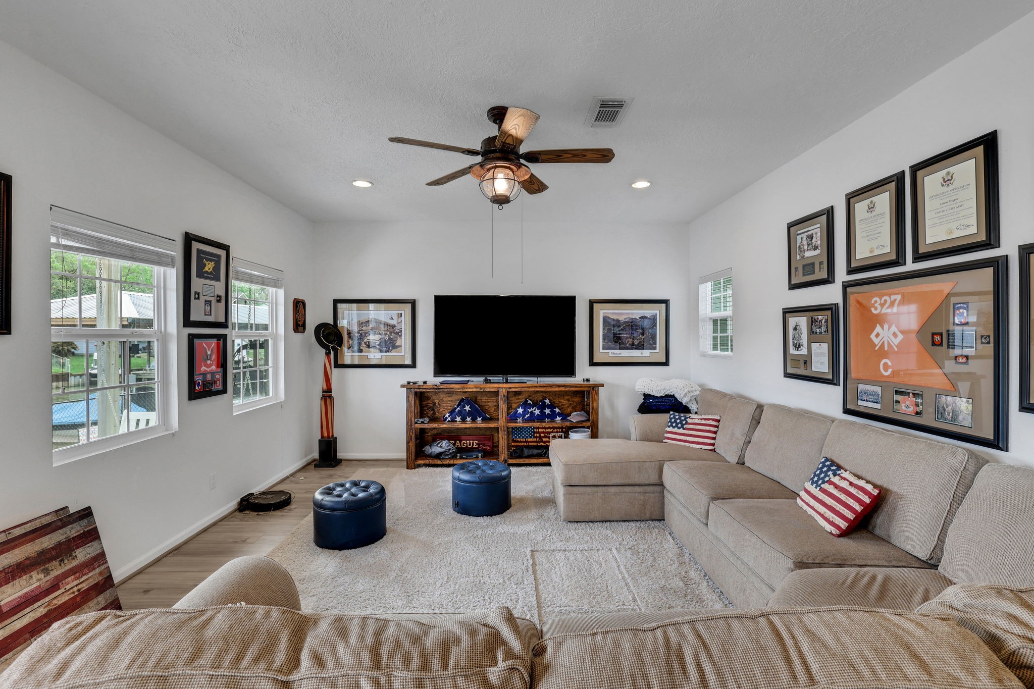 331 Holiday Lane Coldspring, TX 77331 - Photo 10 of 36 This inviting living room is spacious enough for large furniture making it perfect for relaxation and entertaining. The ceiling fan adds comfort, and the neutral tones create a warm, welcoming atmosphere.