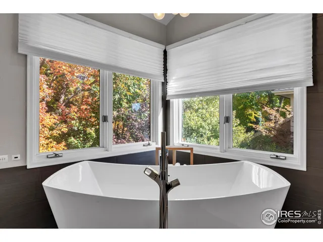 a view of a room with window and outdoor space