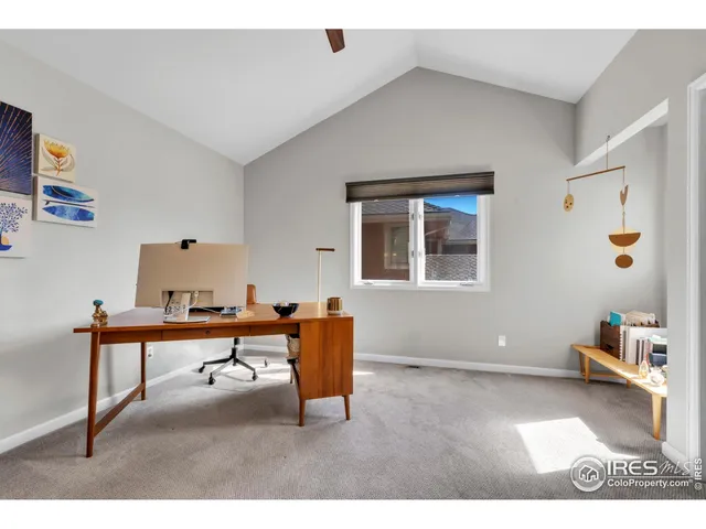 a living room with furniture a rug and a window