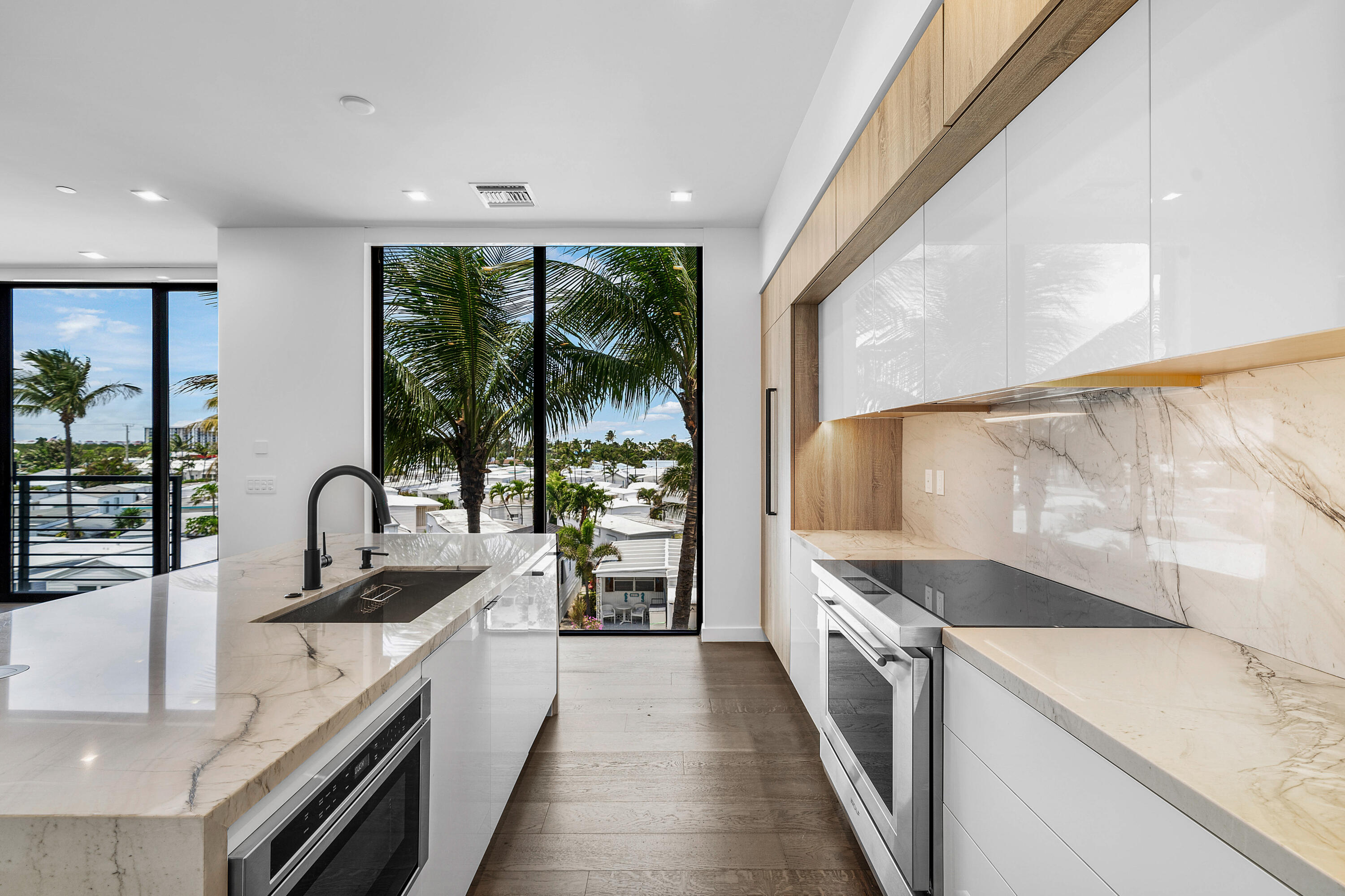 11505 Old Ocean Boulevard Ocean Ridge, FL 33435 - Photo 12 of 35 a kitchen with a sink and a large window