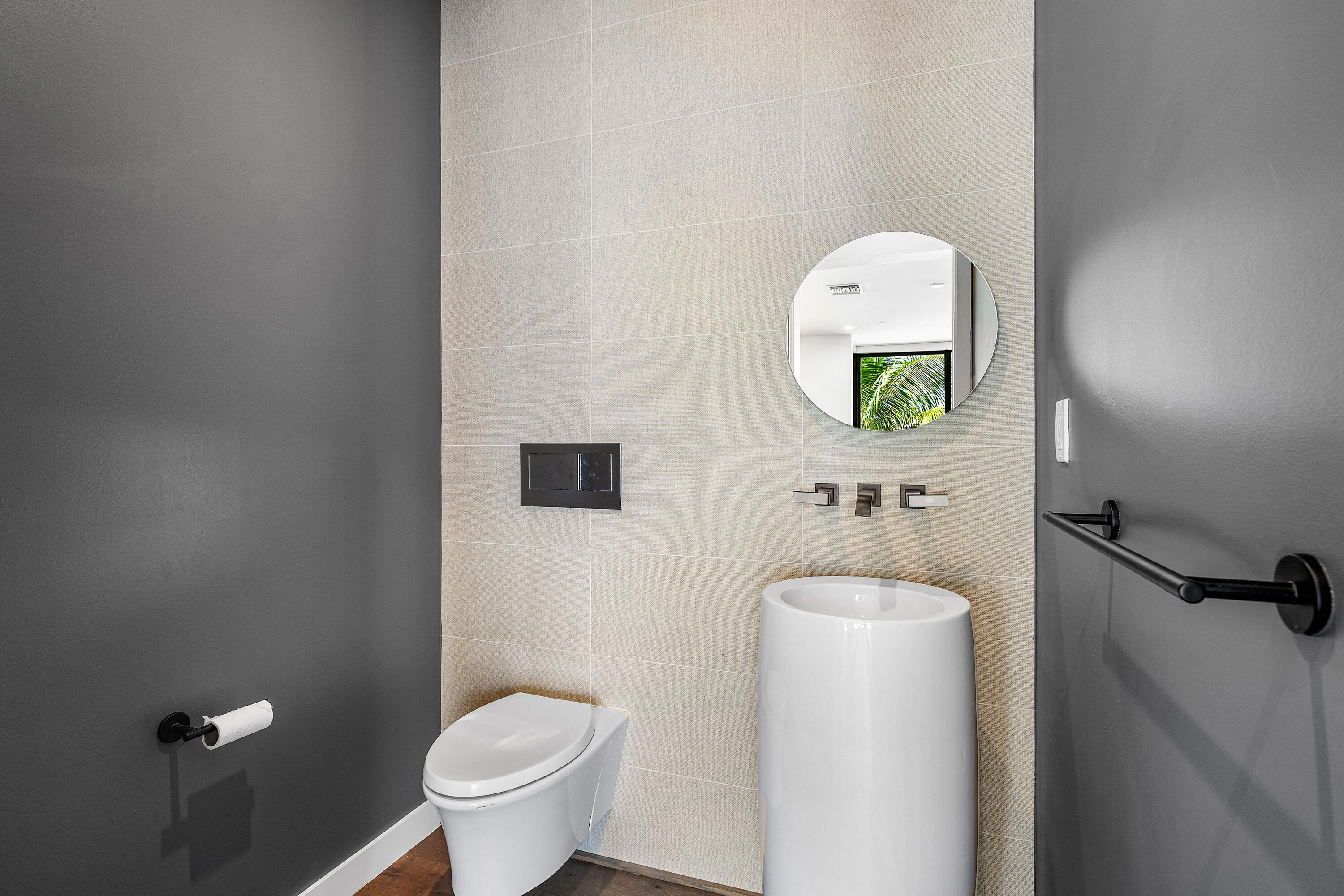 11505 Old Ocean Boulevard Ocean Ridge, FL 33435 - Photo 13 of 35 a bathroom with a toilet and a sink