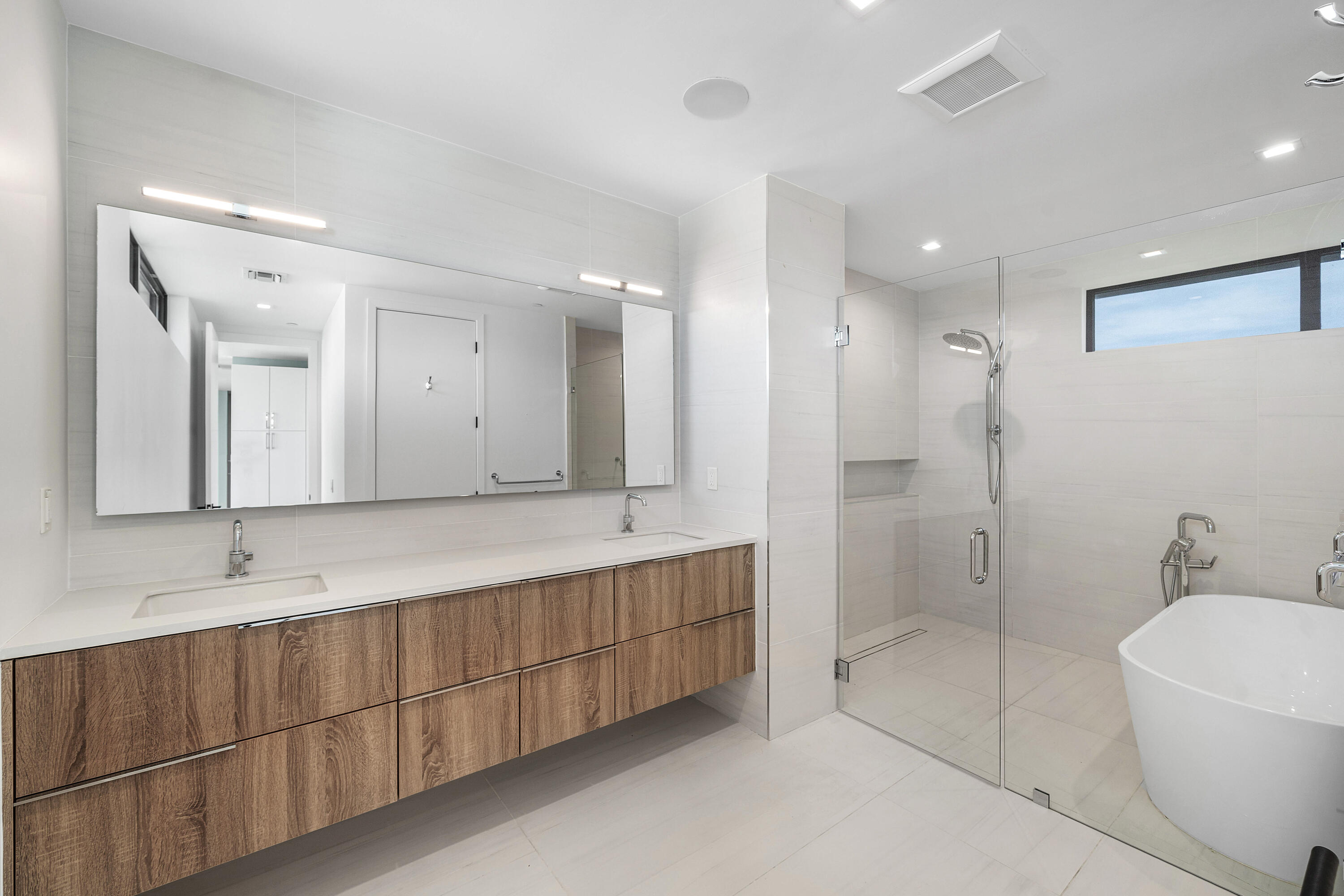 11505 Old Ocean Boulevard Ocean Ridge, FL 33435 - Photo 15 of 35 a bathroom with a double vanity sink mirror and double