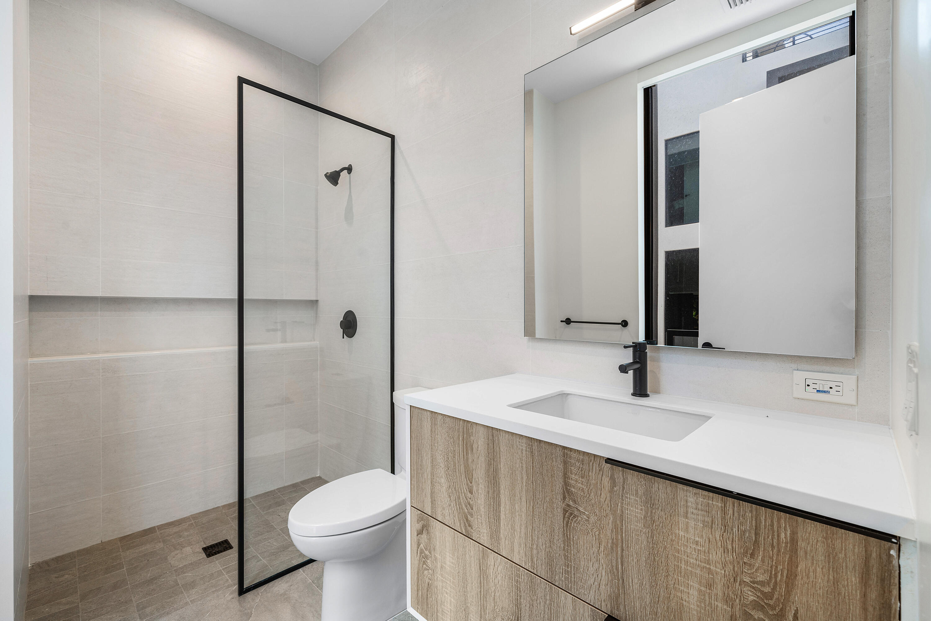 11505 Old Ocean Boulevard Ocean Ridge, FL 33435 - Photo 23 of 35 a bathroom with a granite countertop sink toilet and shower