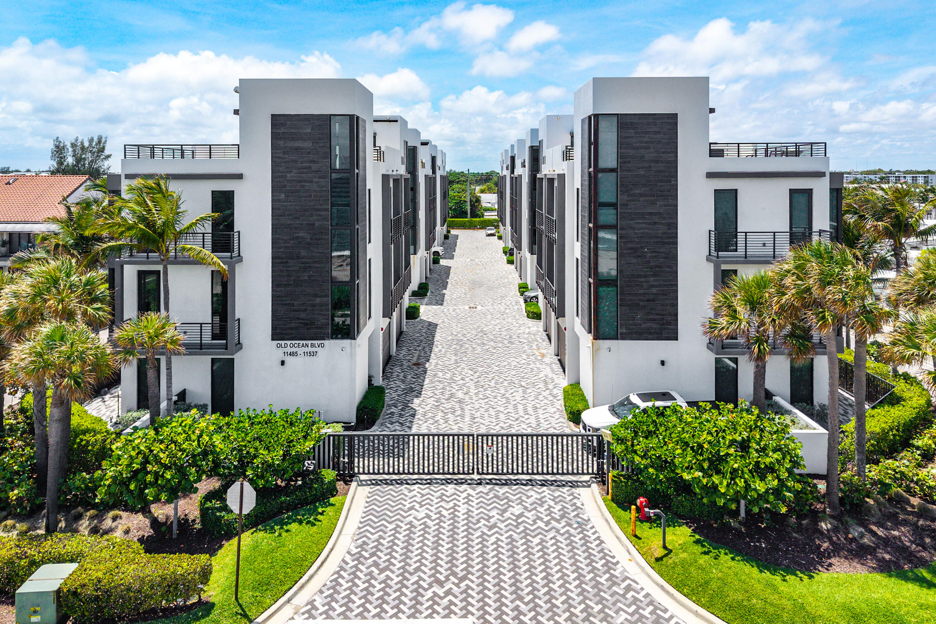 11505 Old Ocean Boulevard Ocean Ridge, FL 33435 - Photo 27 of 35 a front view of a building with a garden