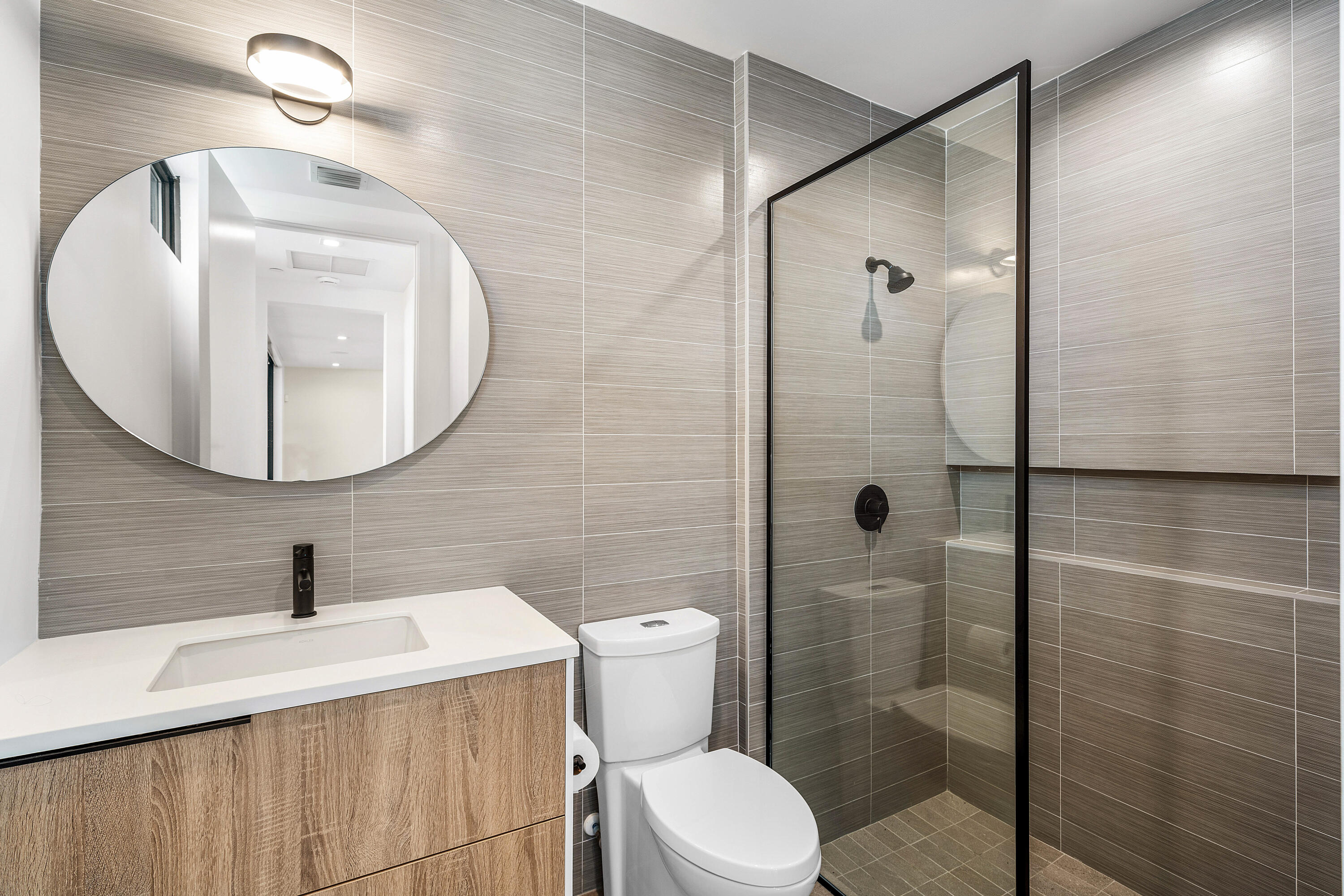 11505 Old Ocean Boulevard Ocean Ridge, FL 33435 - Photo 7 of 35 a bathroom with a sink toilet and shower